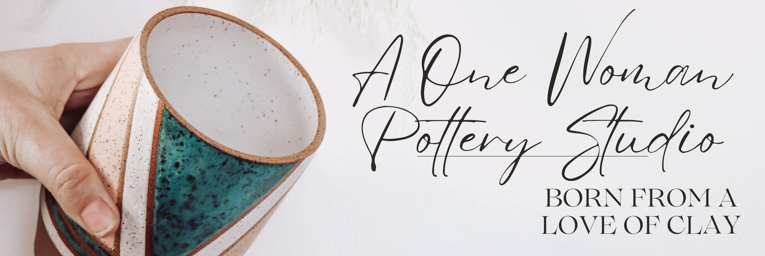 Close up of hand holding a handmade ceramic vase (Nicola Vase) with teal glazed geometric design. Text overlay reads "A One Woman Pottery Studio - Born From A love Of Clay."