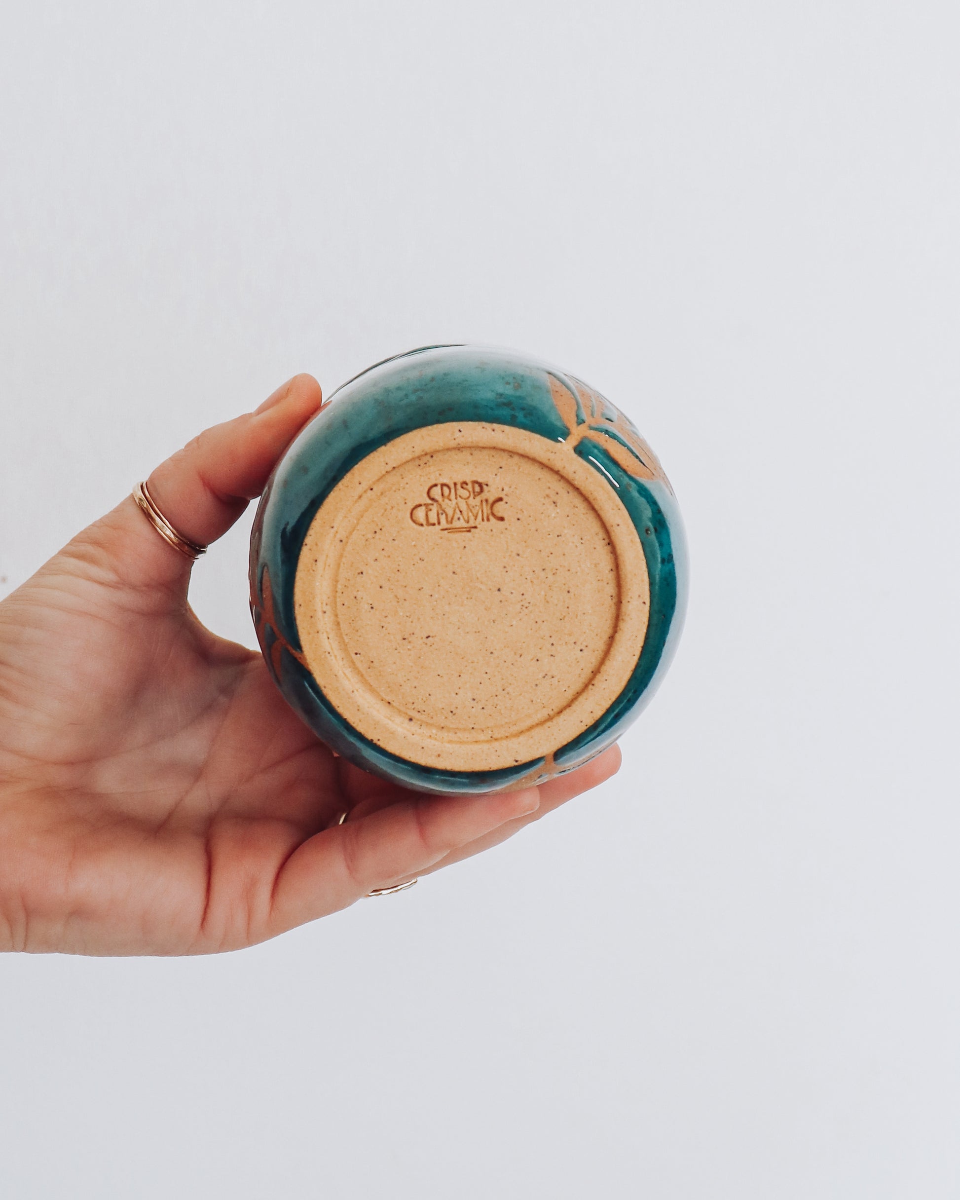 Bottom view of leaf tumbler showing unglazed base with Crisp Ceramic Makers Mark.